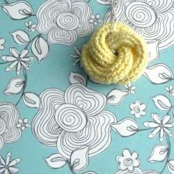 Etarnally. Crochet knot pendant in pale yellow 