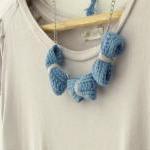 Three crochet bows necklace. Pale blue and grey cotton yarn