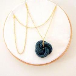 Etarnally. Crochet knot pendant in cypress green